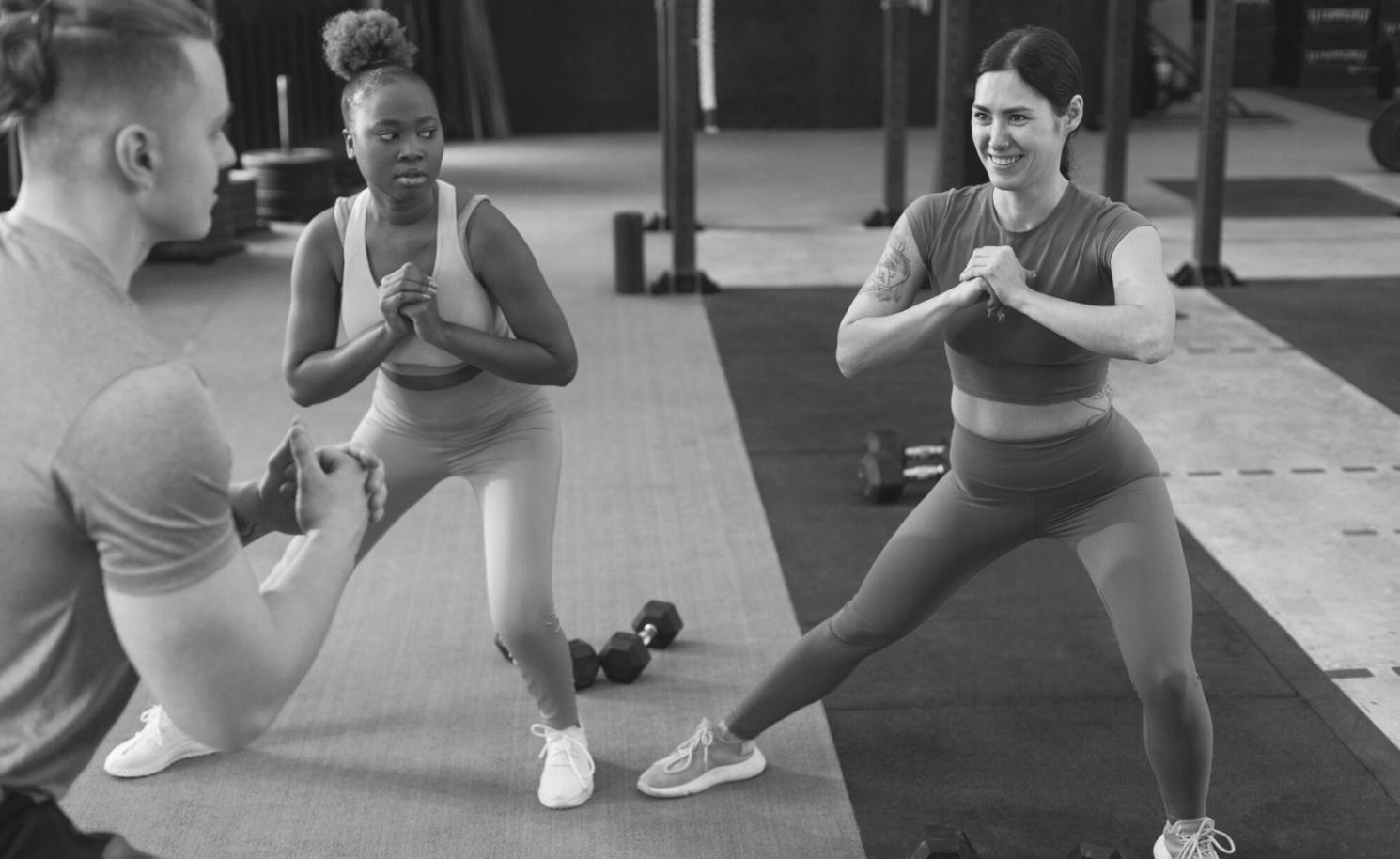 Instructor demonstrating proper floor exercise technique